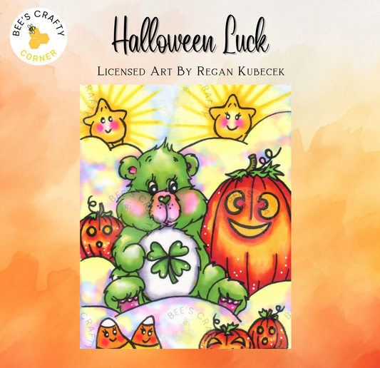 The image is a colorful illustration featuring a green teddy bear holding a four-leaf clover, surrounded by various Halloween-themed elements such as pumpkins, stars, and a smiling jack-o-lantern.