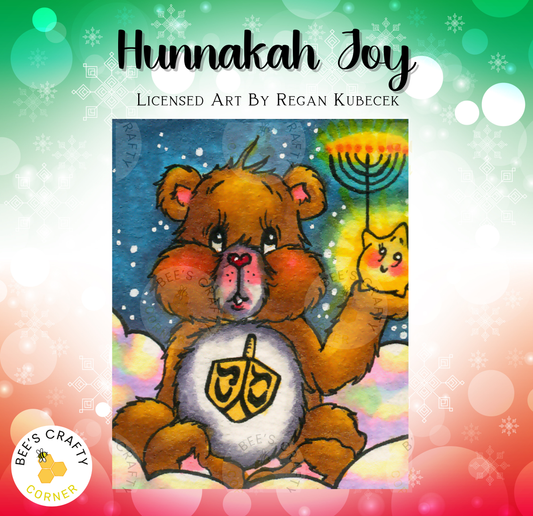 The image is a colorful illustration of a teddy bear holding a menorah, with a small cat in the background. The background is a mix of blue, green, and pink, and there are snowflakes scattered throughout.