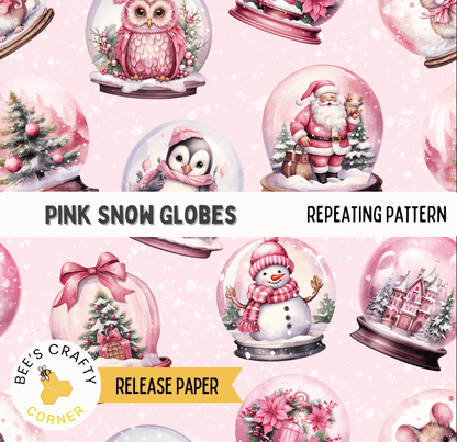 a repeating pattern of pink snow globes, each containing a different scene, such as a penguin, a snowman, a Christmas tree, and a castle.