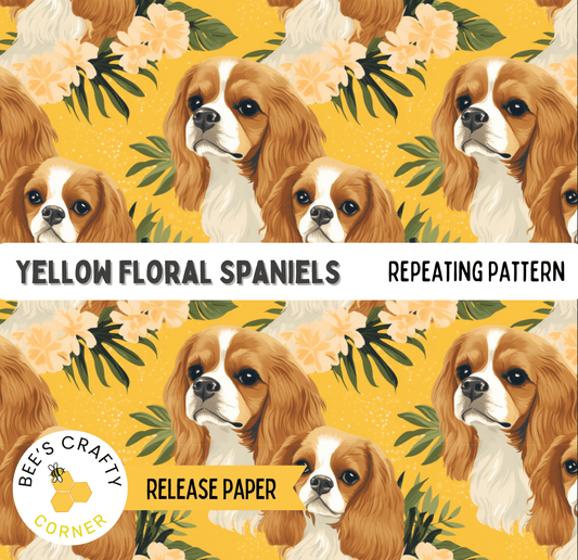 The image is a repeating pattern of yellow floral spaniels against a yellow background with green leaves.
