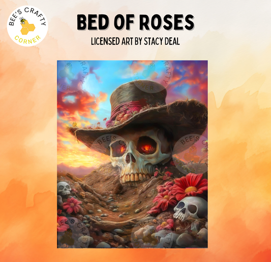 The image is a painting titled "Bed of Roses" by an artist named Stacy Deal. The painting features a skull wearing a hat and surrounded by flowers and rocks, creating a surreal and whimsical scene.