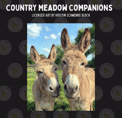Two donkeys standing together in a field, with a blue sky and trees in the background.