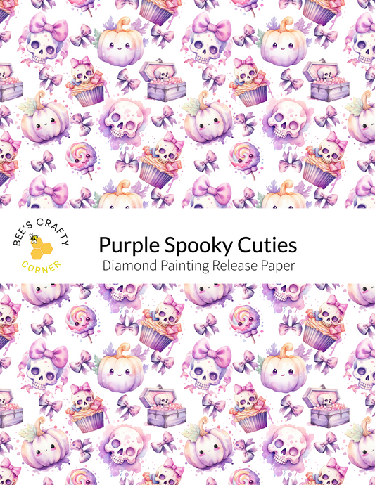 The image is a repeating pattern of various spooky and whimsical illustrations, including skulls, pumpkins, cupcakes, and other Halloween-themed objects. The pattern is predominantly purple and white, with some accents of pink and orange. The text "Purple Spooky Cuties Diamond Painting Release Paper" is displayed in the center of the image, indicating that this is a release paper for a diamond painting kit focused on creating cuties.