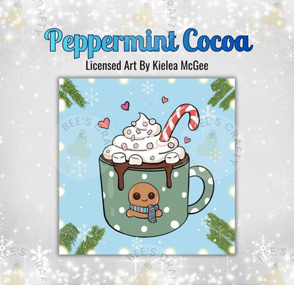 The image is a square illustration of a peppermint cocoa drink, featuring a mug with a gingerbread man and a candy cane. The background is a light blue color with white snowflakes scattered throughout.