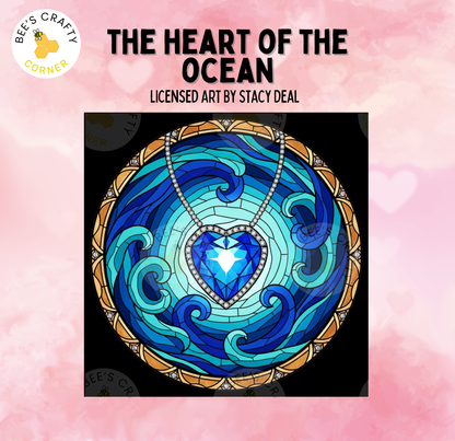 The image is a vibrant stained glass artwork depicting a heart-shaped gemstone surrounded by swirling blue and turquoise waves, set against a pink background.
