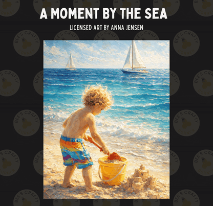 A young child playing in the sand on a beach, with two sailboats visible in the background.