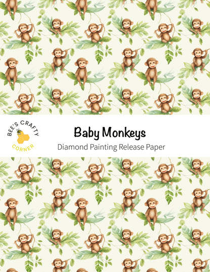 baby monkeys on a white background with green leaves
