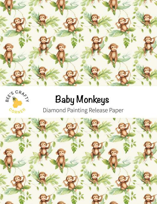 baby monkeys on a white background with green leaves
